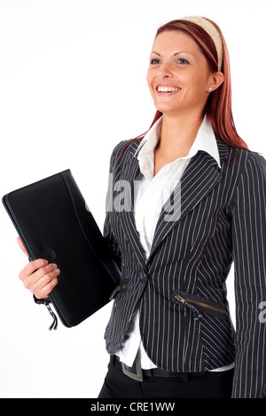 junge Geschäftsfrau mit dem Aktenkoffer Stockfoto