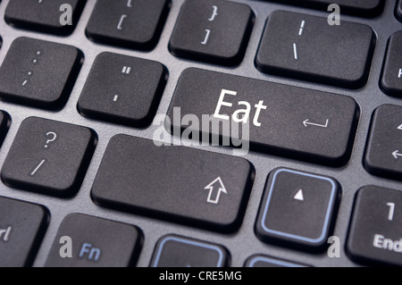 Essen oder Essen Konzepte für Lebensmittel im Zusammenhang mit Lebensstil mit Nachricht auf Computer-Tastatur. Stockfoto