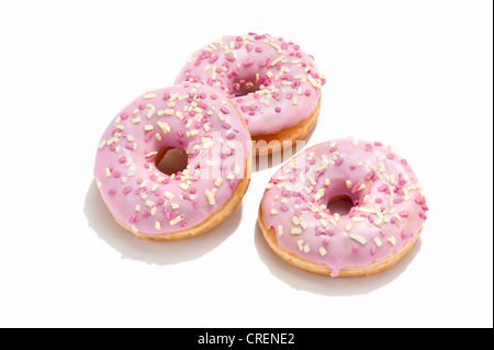 Drei ring Krapfen mit rosa Zuckerguss Stockfoto