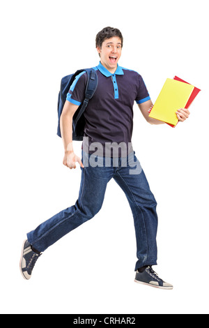 In voller Länge Portrait eines männlichen Studenten springen mit Notebooks in der Hand isoliert auf weißem Hintergrund Stockfoto