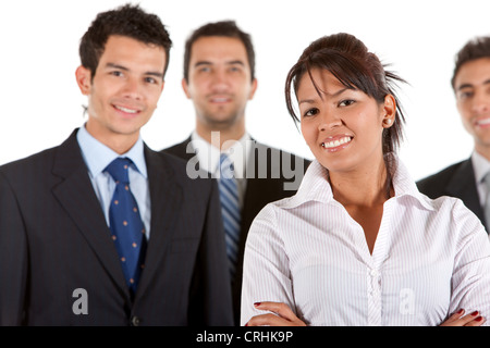 junge lächelnde Geschäftsfrau vor ihren Kollegen Stockfoto