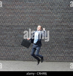 Business-Mann springen Stockfoto