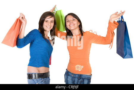 zwei junge Mädchen lächelnd voller Einkaufstaschen Stockfoto