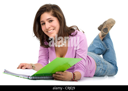 Mädchen lesen ein Notebook auf dem Boden Stockfoto