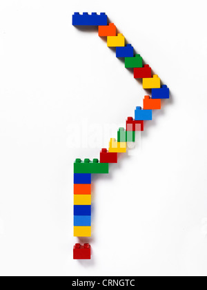 Farbigem Kunststoff bauen von Backsteinen in der Form eines Fragezeichens Stockfoto