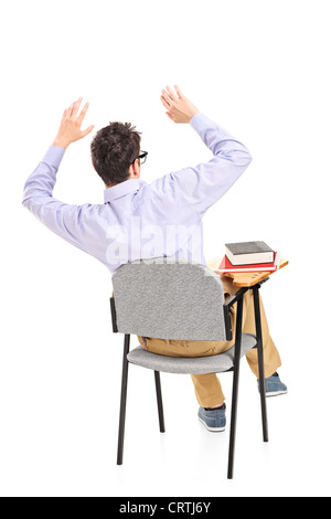 Eine Angst Schüler sitzen auf einem Stuhl isoliert auf weißem Hintergrund Stockfoto
