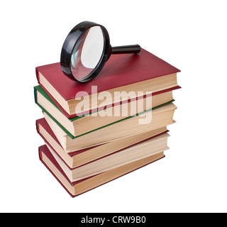 Stapel von Büchern und Lupe Stockfoto