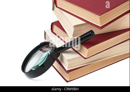 Stapel von Büchern und Lupe Stockfoto