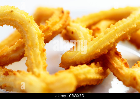 Churros-Gastro-Szene Hervorhebung Frühstück appetitliche Farbe und Textur Stockfoto