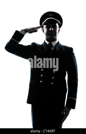 ein kaukasischer Mann in Airline pilot Uniform salutieren Silhouette im Studio isoliert auf weißem Hintergrund Stockfoto