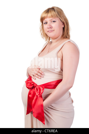 Schwangere Frau streichelt ihren Bauch, auf weißem Hintergrund Stockfoto