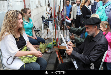 Streetart-Künstler zeichnen Porträt der jungen Frau in Montmartre Paris Frankreich Stockfoto
