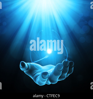 Geheimnisvolle Kraft - offene Hand mit einem gleißenden Licht Stockfoto