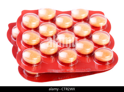 gelben Pillen isoliert auf weißem Hintergrund Stockfoto