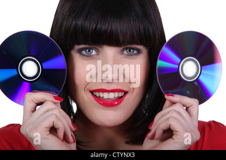 Brünette mit CDs Stockfoto