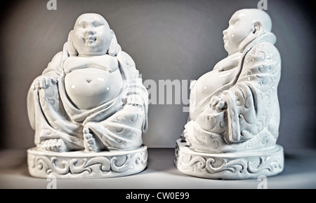 Buddha ceramic statue isolated on gray background Stockfoto