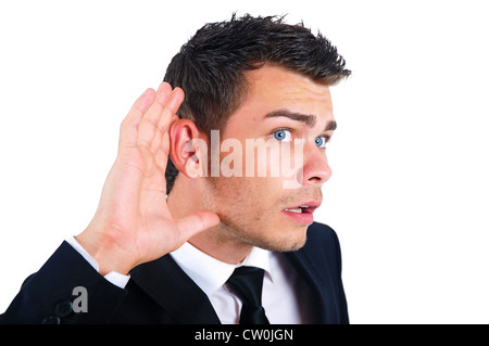 Isolierte junger Geschäftsmann hören Stockfoto