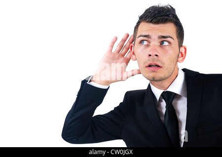 Isolierte junger Geschäftsmann hören Stockfoto