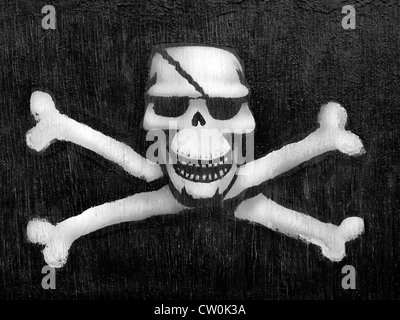 Piraten-Symbole auf der Hafenmauer, Lyme Regis, Dorset, Großbritannien Stockfoto