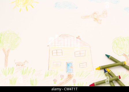 Ein echtes Kind mit einige Buntstifte Zeichnung. Stockfoto