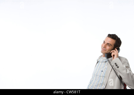 Geschäftsmann am Telefon sprechen und Lächeln Stockfoto