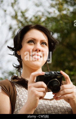 Frau mit einer digitalen Kamera Stockfoto
