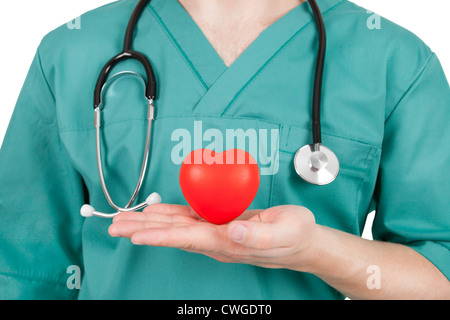 Arzt mit Herz fliegen in seiner Hand - Studio gedreht Stockfoto