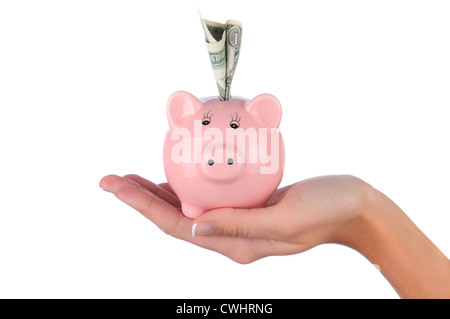 Nahaufnahme von einer Frau Hand hält ein rosa Sparschwein mit einer Dollarnote in den oberen Steckplatz stecken. Stockfoto