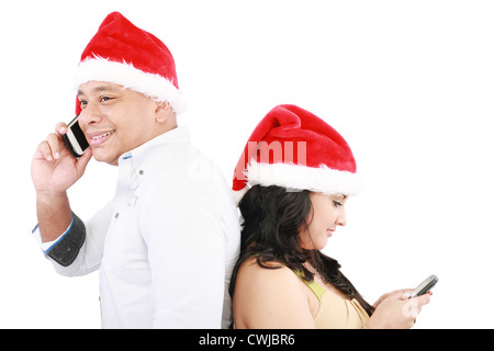 Fröhliche Weihnachten Menschen Rücken an Rücken isoliert auf weiss Stockfoto