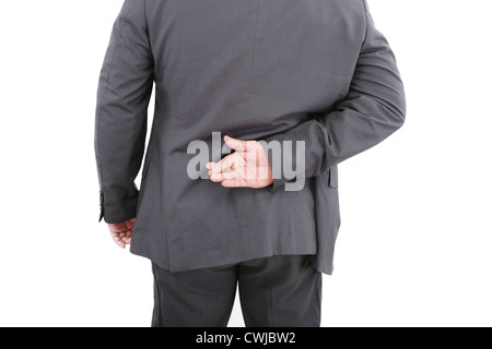 Lügner Geschäftsmann mit gekreuzten Fingern hinten. Isoliert auf weißem Hintergrund Stockfoto