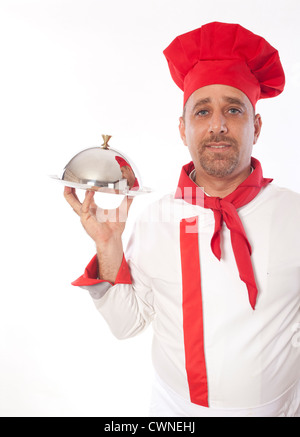 Koch mit Metall Cloche Deckel Deckel und Tablett Stockfoto