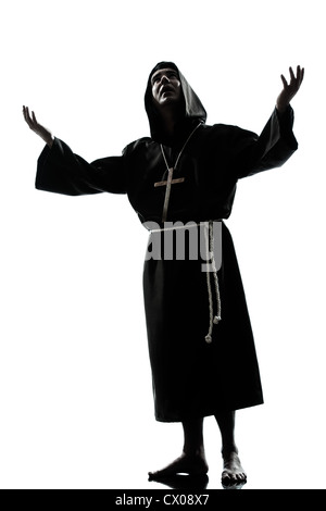 ein kaukasischer Mann Priester beten Silhouette im Studio isoliert auf weißem Hintergrund Stockfoto