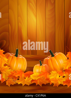Kürbisse auf hölzernen Hintergrund mit Blättern. Herbst Hintergrund.