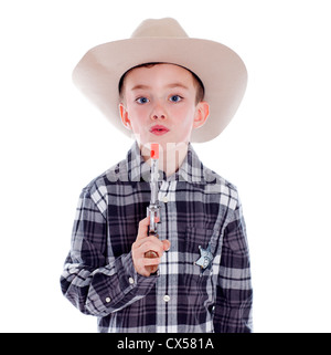 Kleiner Junge gekleidet wie ein Cowboy mit Gewehr Stockfoto