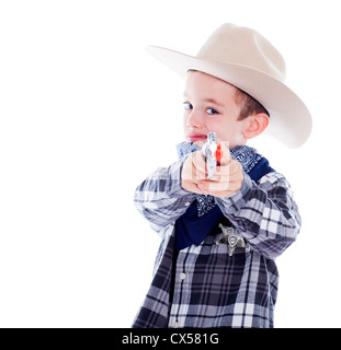 Kleiner Junge gekleidet wie ein Cowboy mit Gewehr Stockfoto