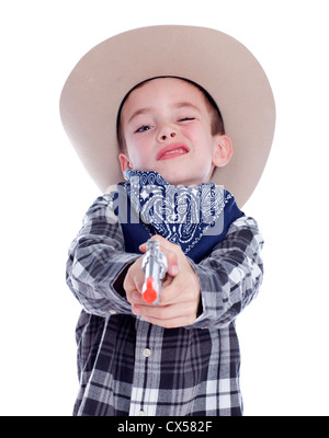 Kleiner Junge gekleidet wie ein Cowboy mit Gewehr Stockfoto