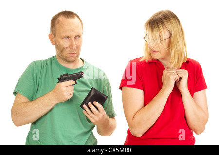 Ein Mann eine Frau mit vorgehaltener Waffe zu halten Stockfoto