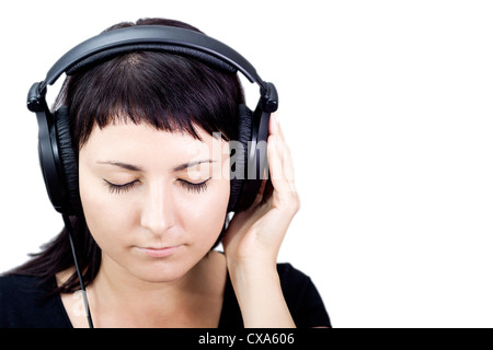 Junge Frau mit Kopfhörern, schönen Musik genießen. Stockfoto