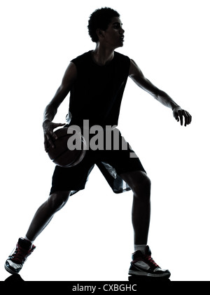 ein junger Mann-Basketball-Spieler-Silhouette im Studio isoliert auf weißem Hintergrund Stockfoto