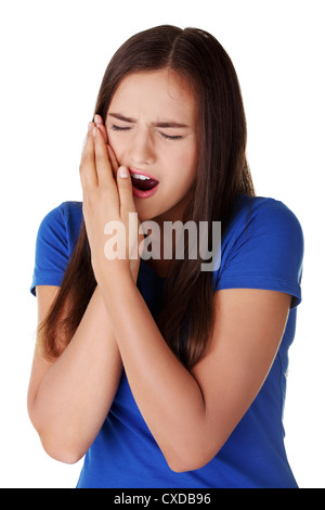 Teen Frau gequetscht Wange mit schmerzlichem Gesicht drücken, als ob sie eine schreckliche Zahnschmerzen hat. Stockfoto