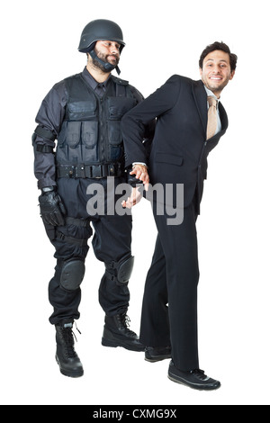 eine beschädigte Geschäftsmann, von einem Swat Agent verhaftet Stockfoto