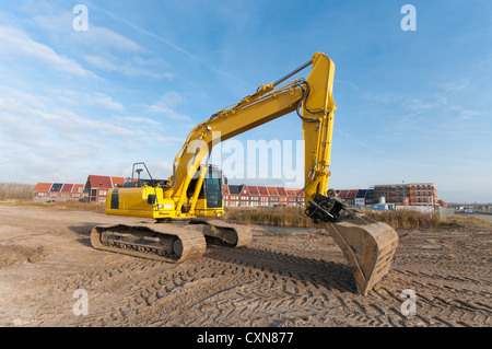 Bagger an einem neu gebauten Wohngebiet Stockfoto