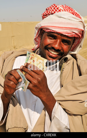 Kamel-Treiber mit Einsätzen, Al Sheehaniya, Camel racing Track, Doha, Katar, Vereinigte Arabische Emirate, Naher Osten Stockfoto