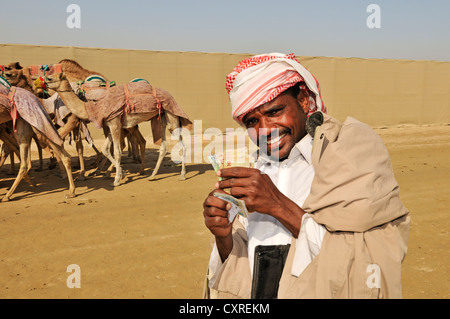 Kamel-Treiber mit Einsätzen, Al Sheehaniya, Camel racing Track, Doha, Katar, Vereinigte Arabische Emirate, Naher Osten Stockfoto