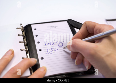 Handschrift eines Termins in einem Tagebuch, personal Organizer Stockfoto