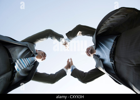 Business-Team beitreten Hände um ihren Erfolg zu feiern Stockfoto