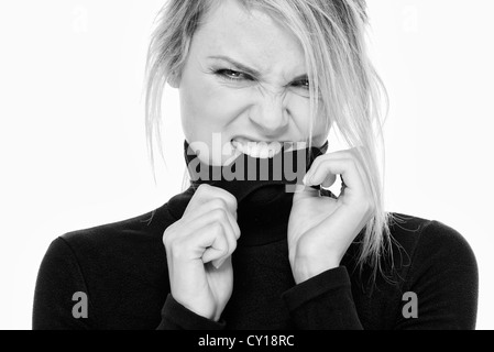 Frau beißende Rollkragen Pullover flirten Stockfoto