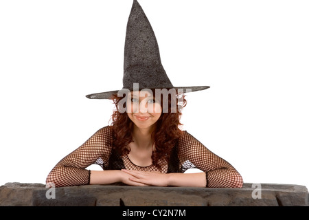 Porträt von Latina Teenager Mädchen in schwarz Halloween Hut und Netzstrümpfe Kleid Stockfoto