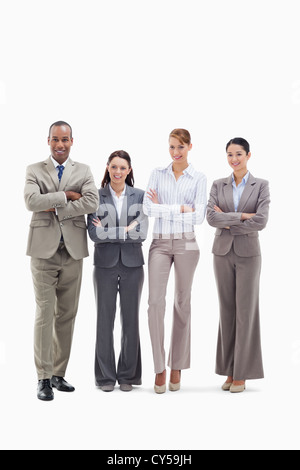 Business Team lächelnd nebeneinander und ihre Arme kreuzen Stockfoto