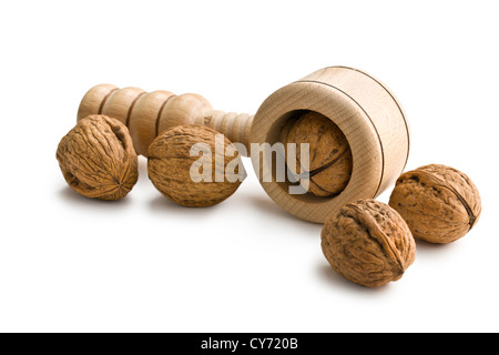 hölzerne Nussknacker und Walnüsse auf weißem Hintergrund Stockfoto